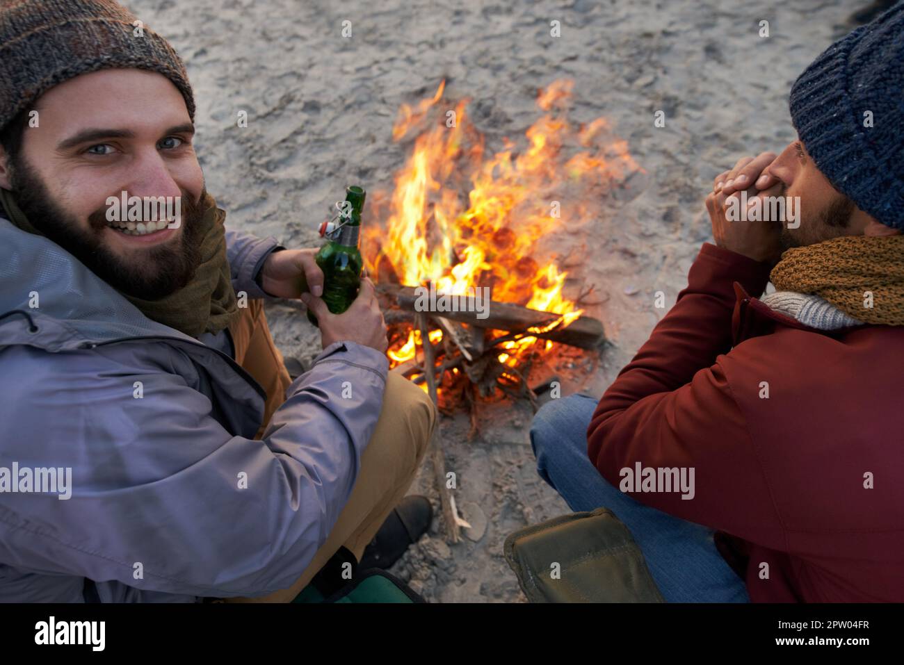 Now this is how you have a campfire. Two young men sitting around a