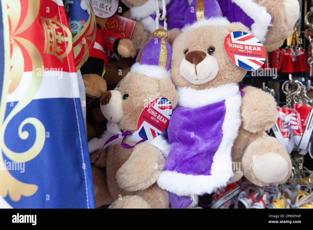 London, UK. 27th Apr, 2023. In central London stalls sell souvenirs for tourists which commemorate the upcoming coronation of King Charles III. from bags and flags to mugs and cuddly toys, it is hoped that the coronation will bring an influx of tourists and a boost to the economy. Credit: Anna Watson/Alamy Live News Stock Photo