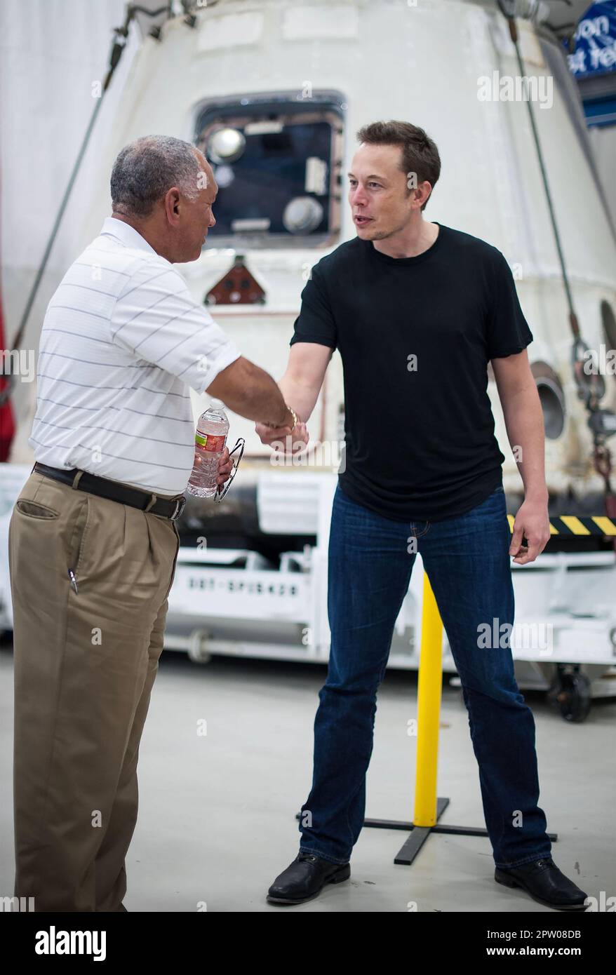 ELON MUSK   NASA Administrator Charles Bolden at left congratulates American entrepreneur Elon Musk in front of the SpaceX Dragon after its successful launch in 2012. Photo: NASA Stock Photo