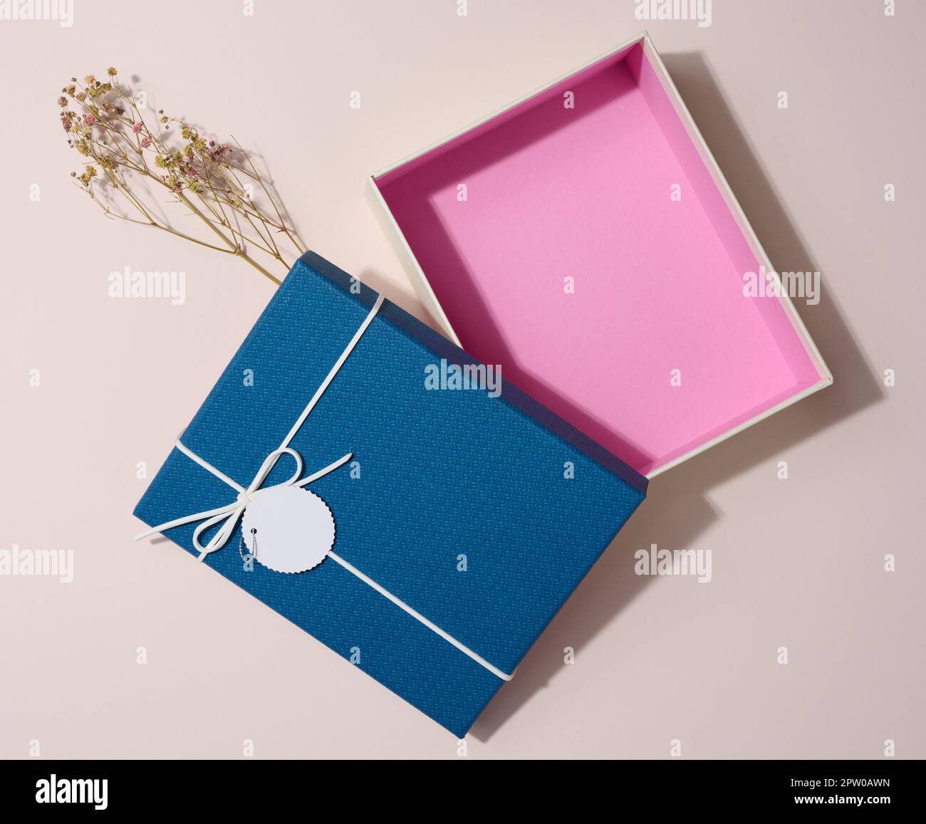 Empty open rectangular gift cardboard box on beige background, top view Stock Photo