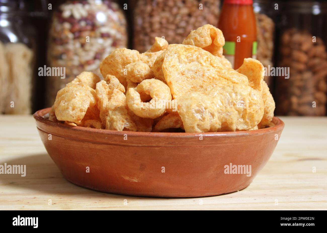 Fried Pork Rinds With Hot Sauce in Rustic Kitchen Stock Photo Alamy
