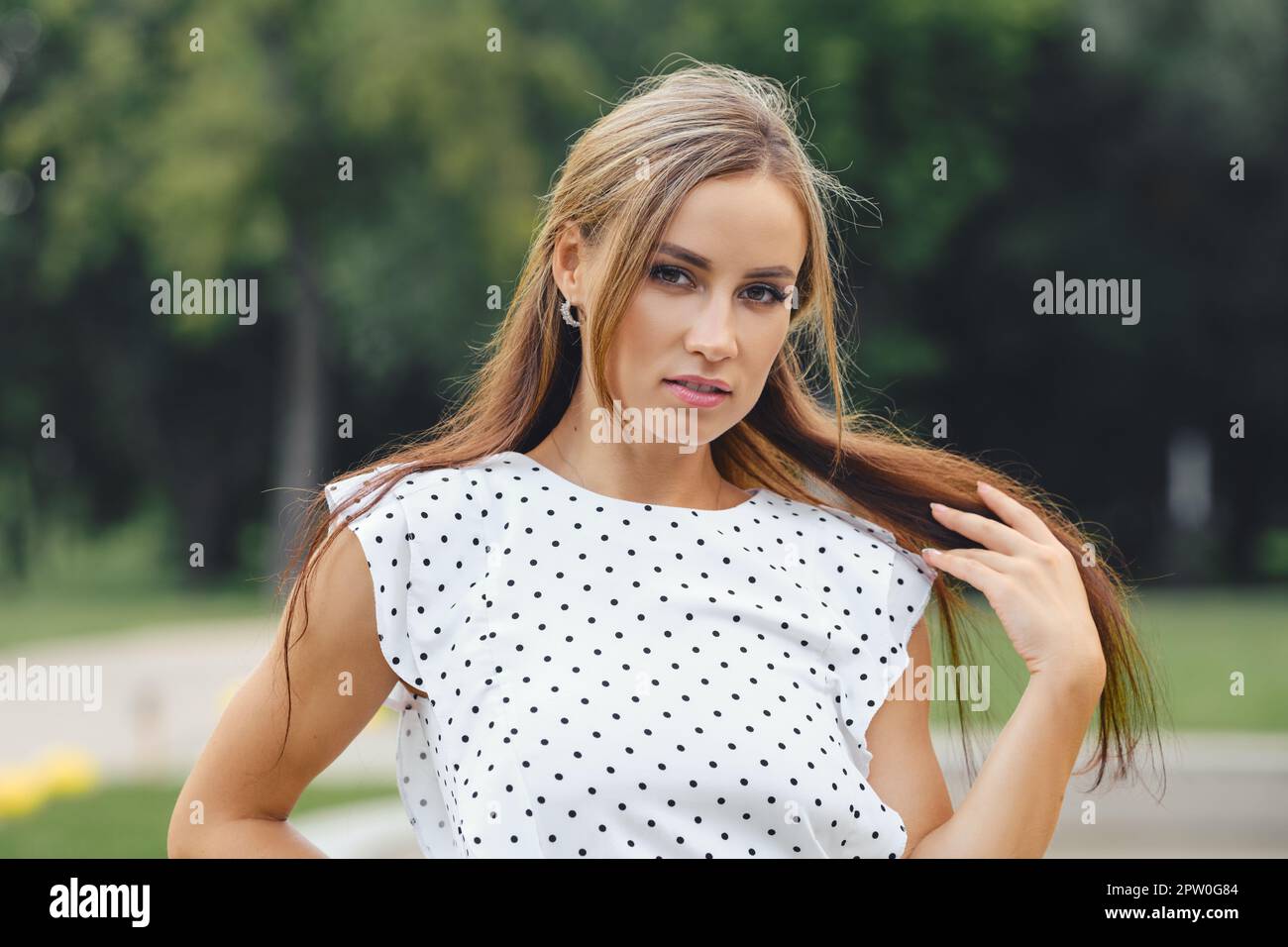 Confident woman with long hair hi-res stock photography and images - Alamy