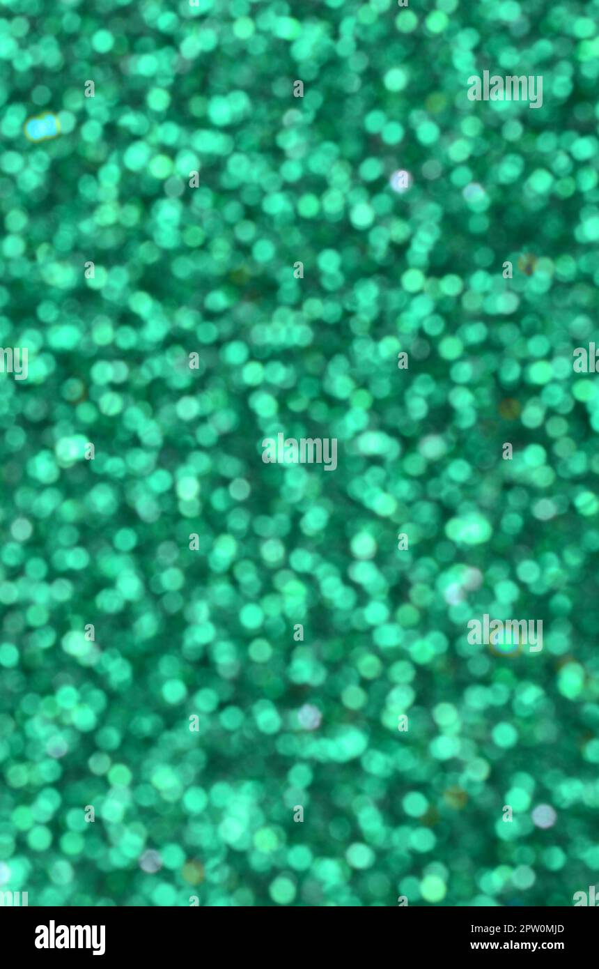 Blurred green decorative sequins. Background image with shiny bokeh ...