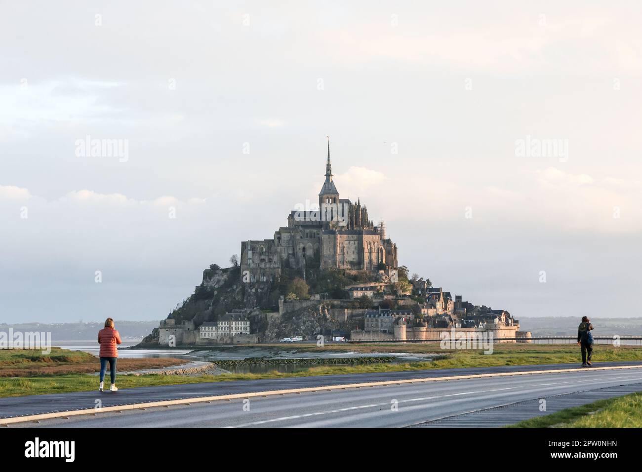 Morning,sunrise,at,Famous,popular,tourist,attraction,Le Mont Saint Michel,Mont Saint Michel,France,French,Europe,European, UNESCO World Heritage Site,on,the,border,between,Normandy,Normandie, and,Brittany,bay,coast,coastal Stock Photo