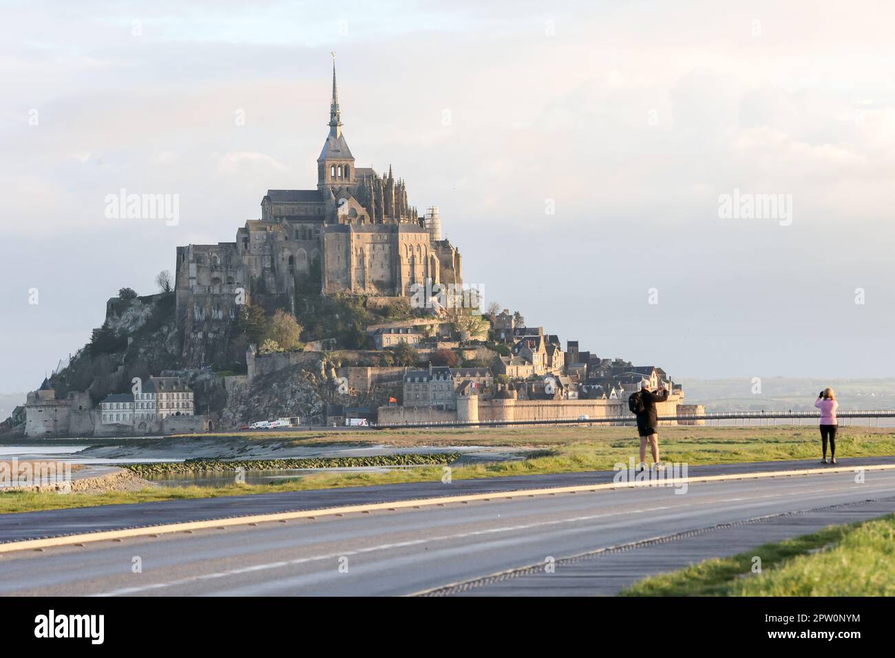 Morning,sunrise,at,Famous,popular,tourist,attraction,Le Mont Saint Michel,Mont Saint Michel,France,French,Europe,European, UNESCO World Heritage Site,on,the,border,between,Normandy,Normandie, and,Brittany,bay,coast,coastal Stock Photo
