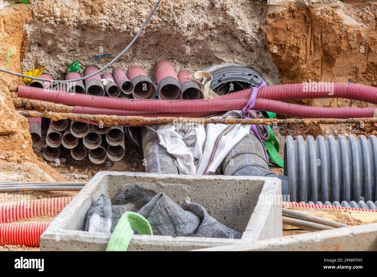 Underground utility supply lines and pipes laid underground and paved