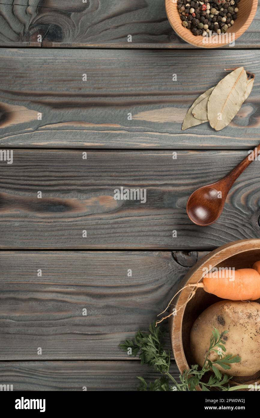 Flavorings and vegetables in tableware. Layout of foodstuffs on wooden