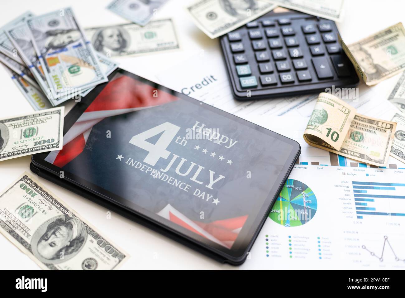 business, office, school and money concept - chart paper, tablet pc 