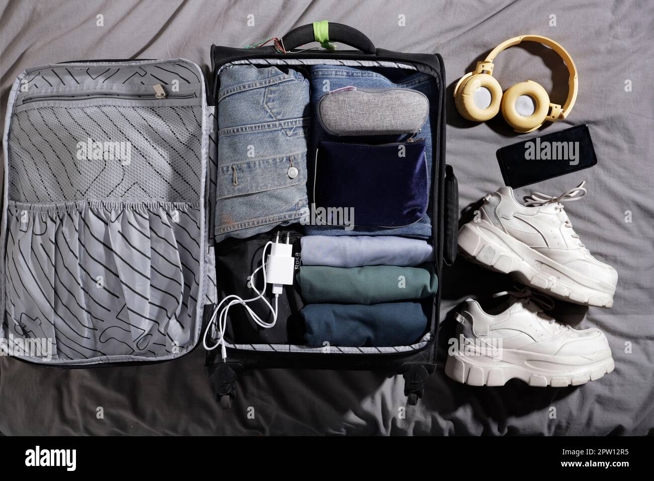 top view of suitcase withcamera and headphones Stock Photo