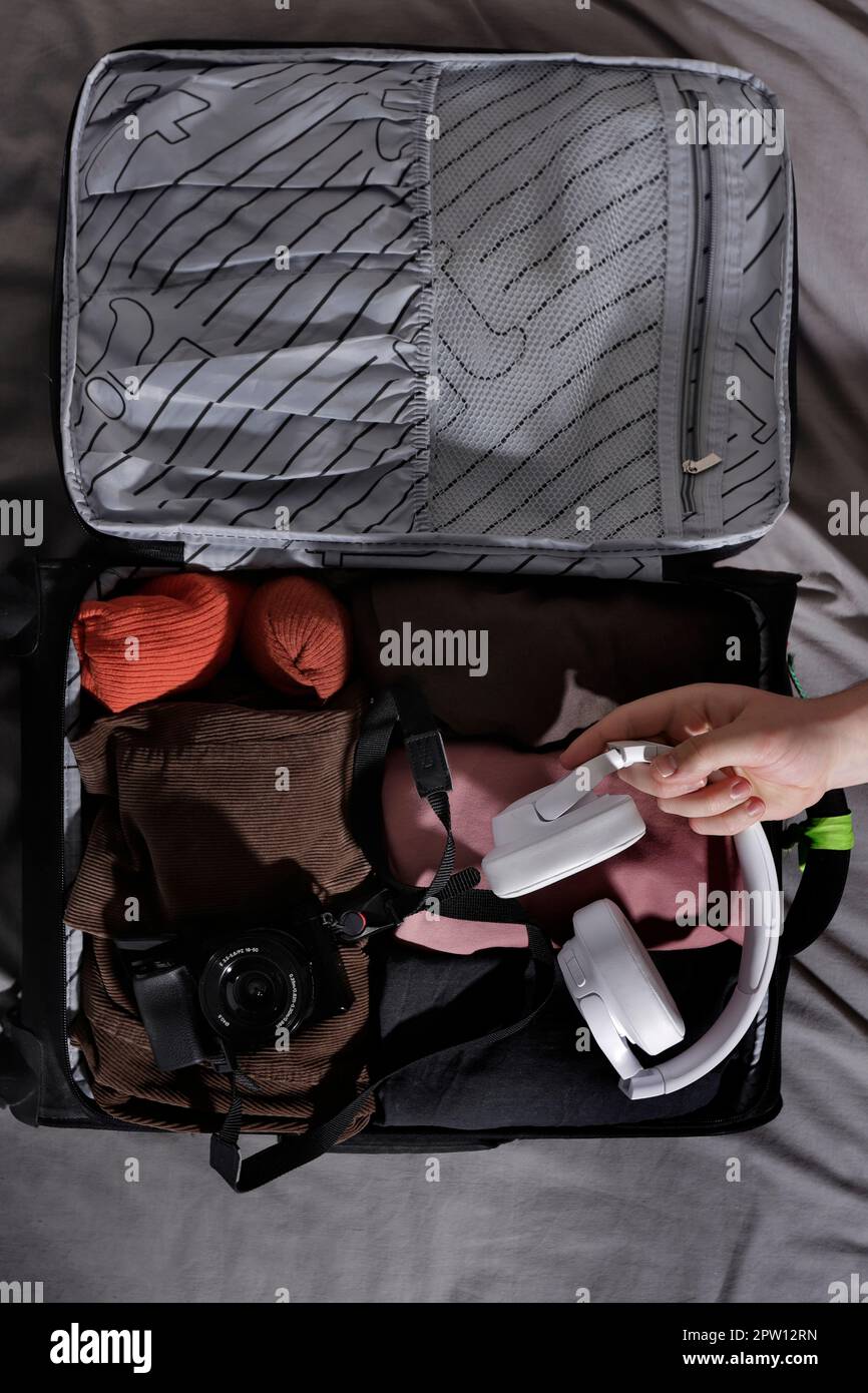 top view of suitcase withcamera and headphones Stock Photo