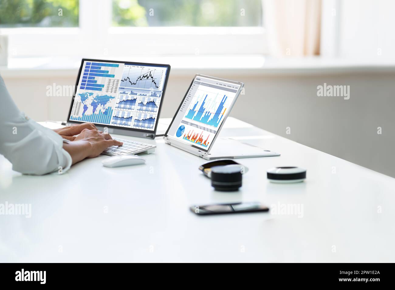 Analyst Employee Working With Spreadsheet Report On Laptop Screen Stock Photo