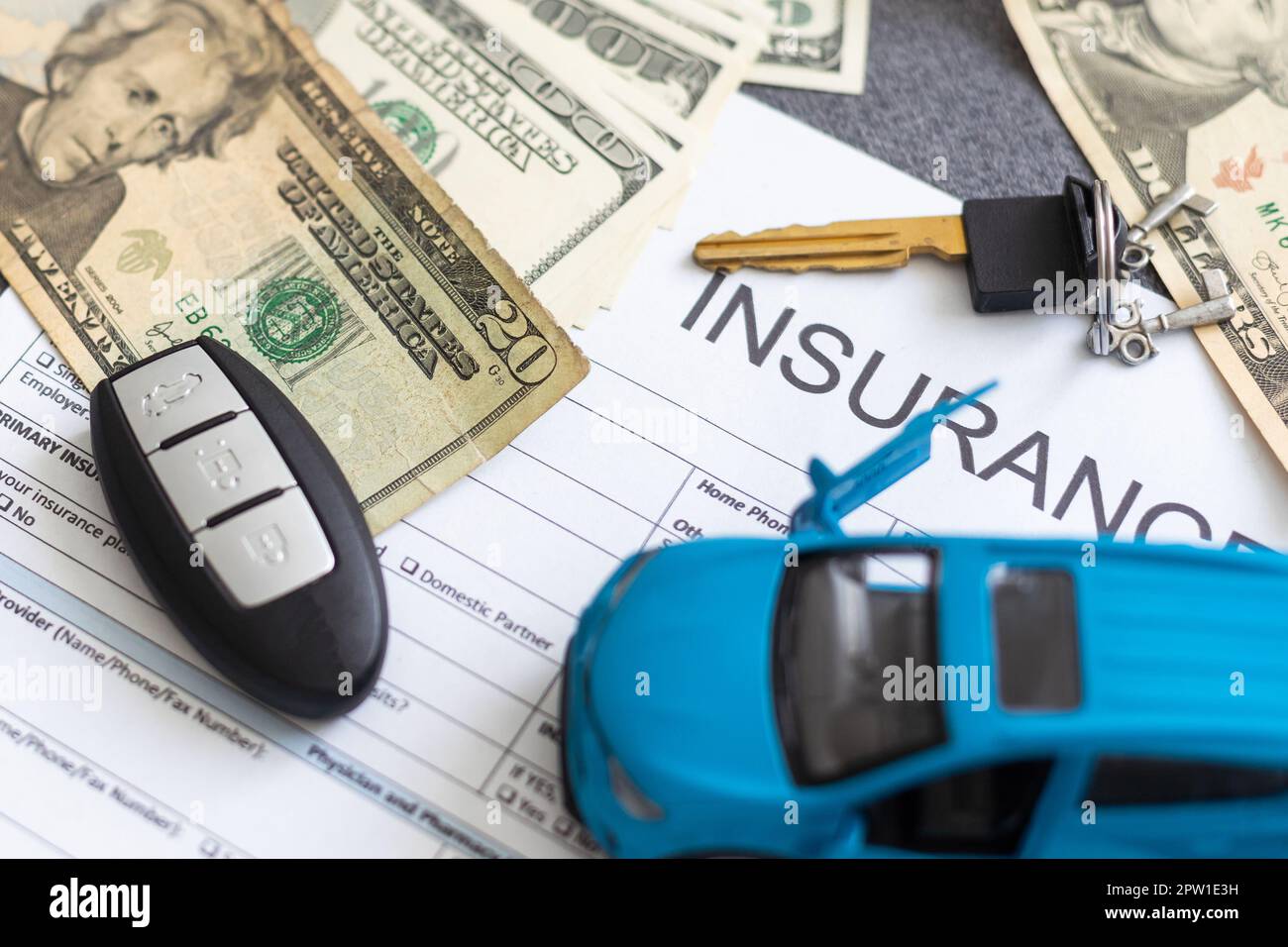 Car insurance form with car key and toy car Stock Photo - Alamy
