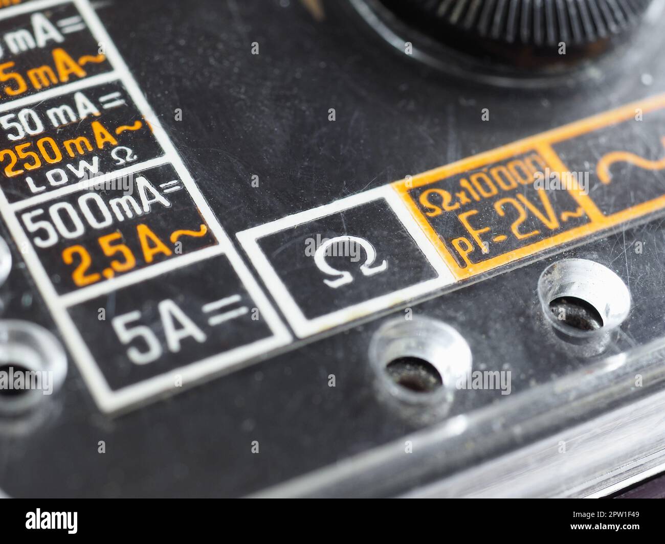 electrical symbols on a vintage analog multimeter measuring instrument