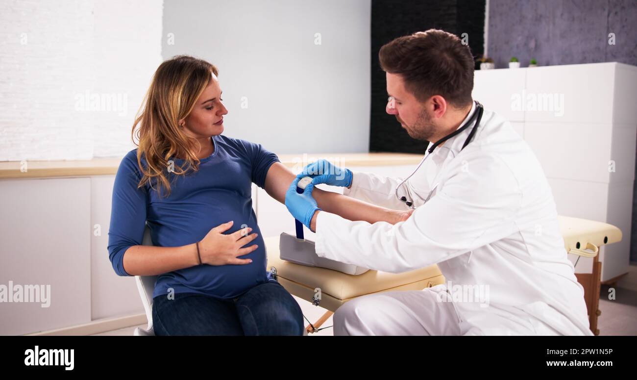 prenatal-screening-doctor-drawing-blood-sample-from-pregnant-woman