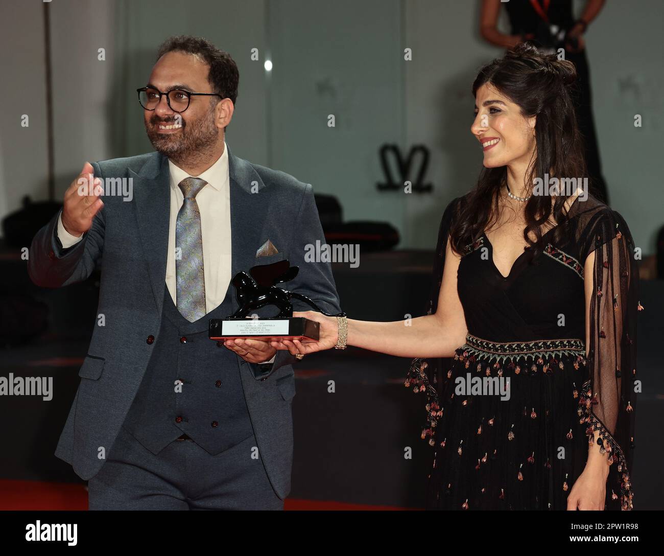 VENICE, ITALY - SEPTEMBER 10: Mina Kavani and Reza Heydari pose with the Special Jury Prize at the 79th Venice  Film Festival on September 10, 2022 Stock Photo