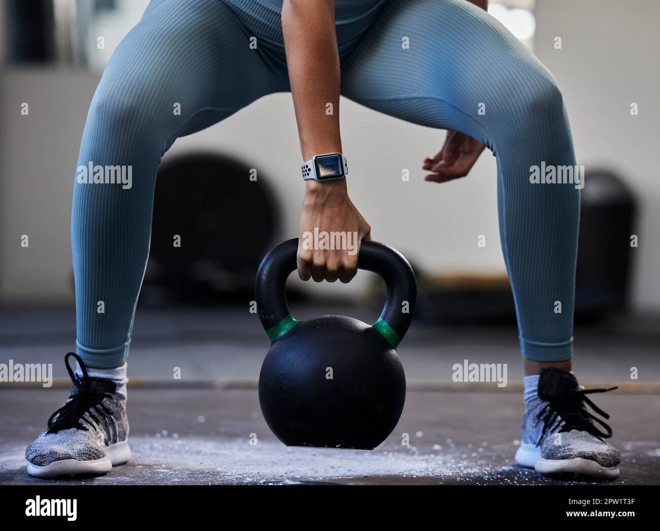 Woman hand kettlebell and gym floor in training fitness or muscle development with smartwatch. Bodybuilder girl weightlifting and strong with sneak Stock Photo Alamy