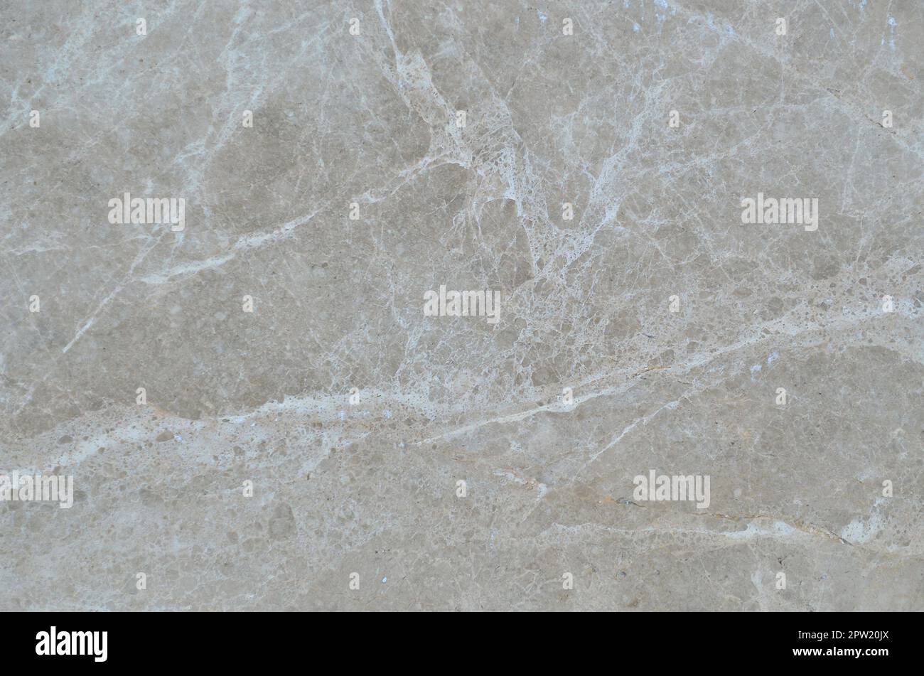 Texture of a solid and slippery beige marble surface as a material for