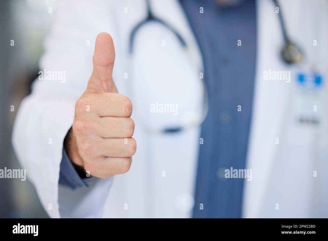 Winner, success and doctor thumbs up at hospital for agreement