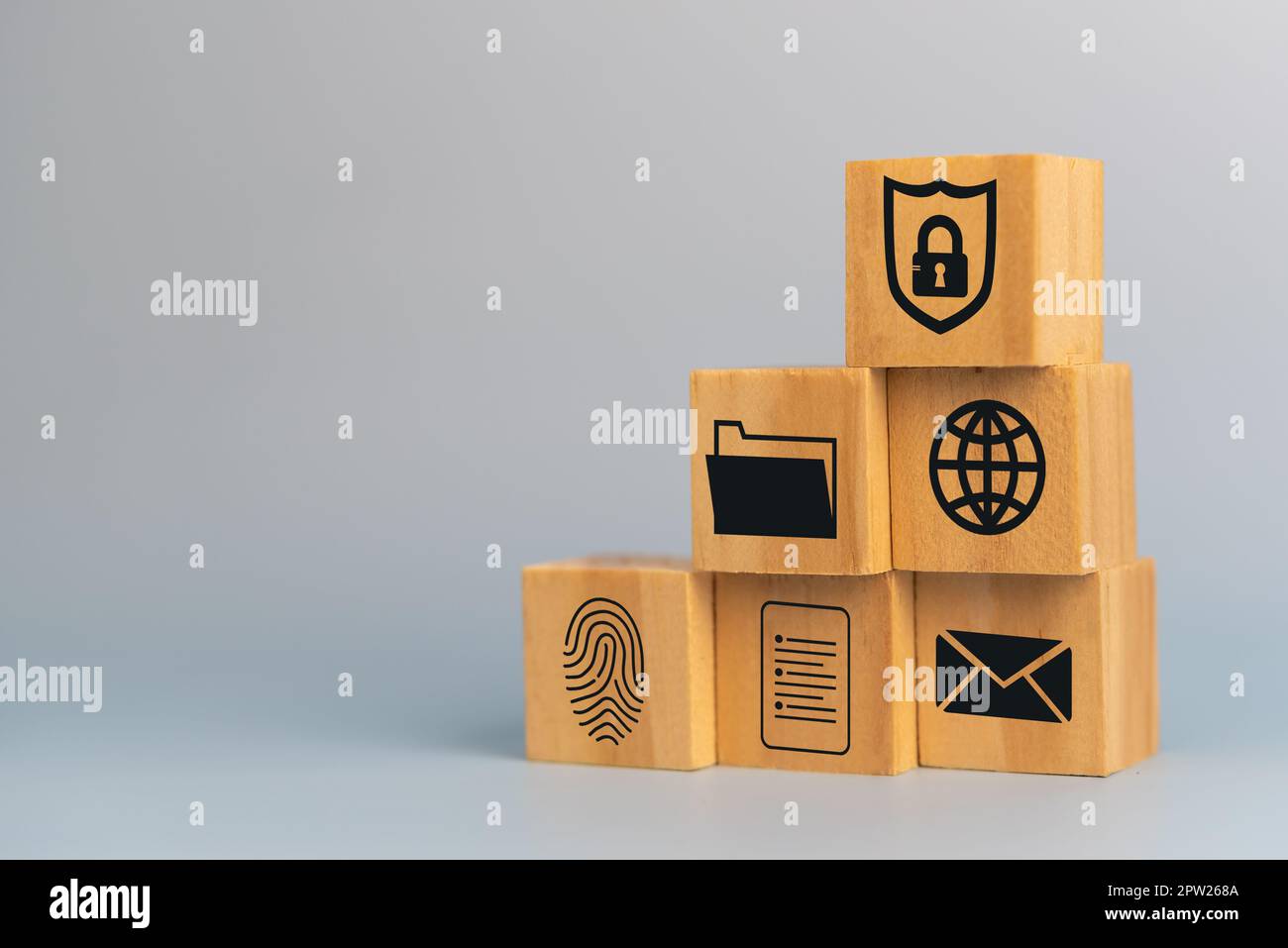 wooden cube for document management digital file data online cybersecurity Protection and data security concept. Stock Photo