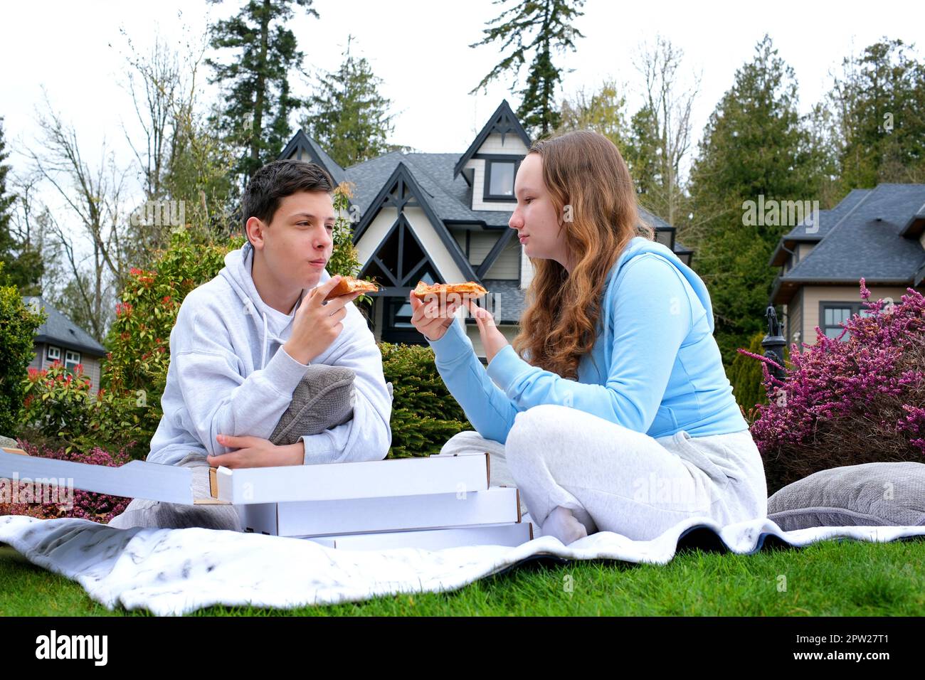a Happy teen students boy and a girl laughing on a lunch break at school. Selective focus. High quality photo Stock Photo