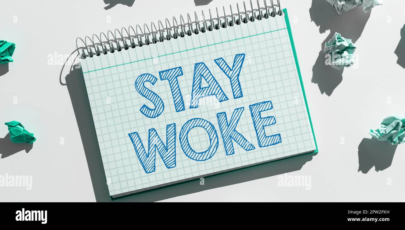Sign displaying stay woke word for being aware of your surroundings 