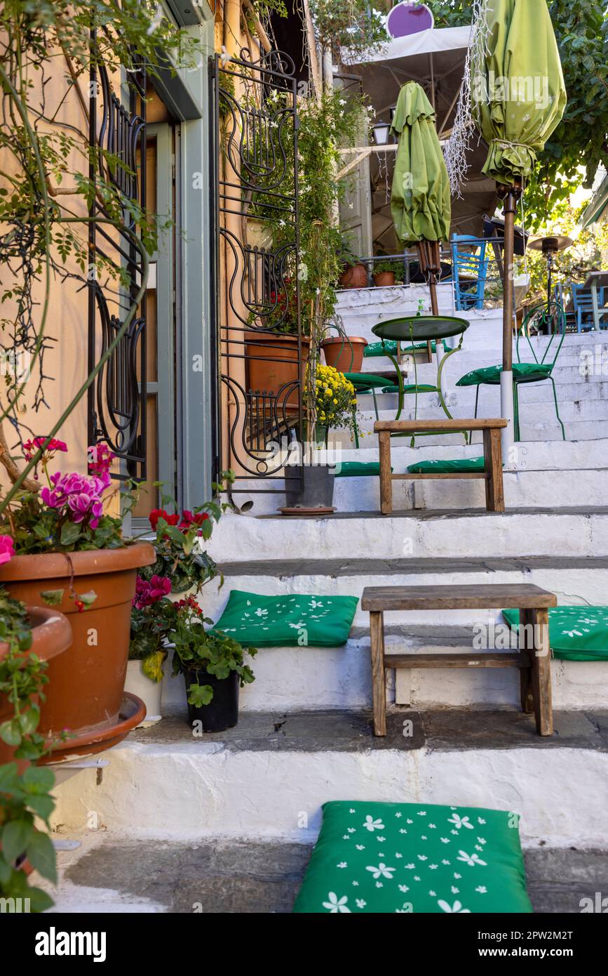Outdoor restaurant on the stairs on the way to the Acropolis in the