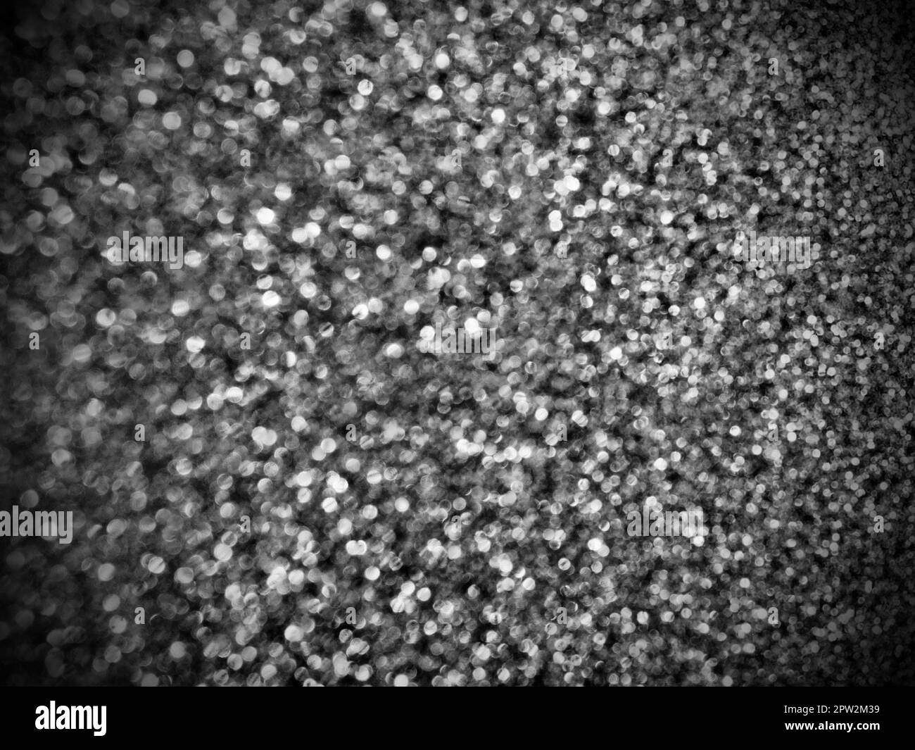 Bokeh light of white glitters. Black white glitter texture background