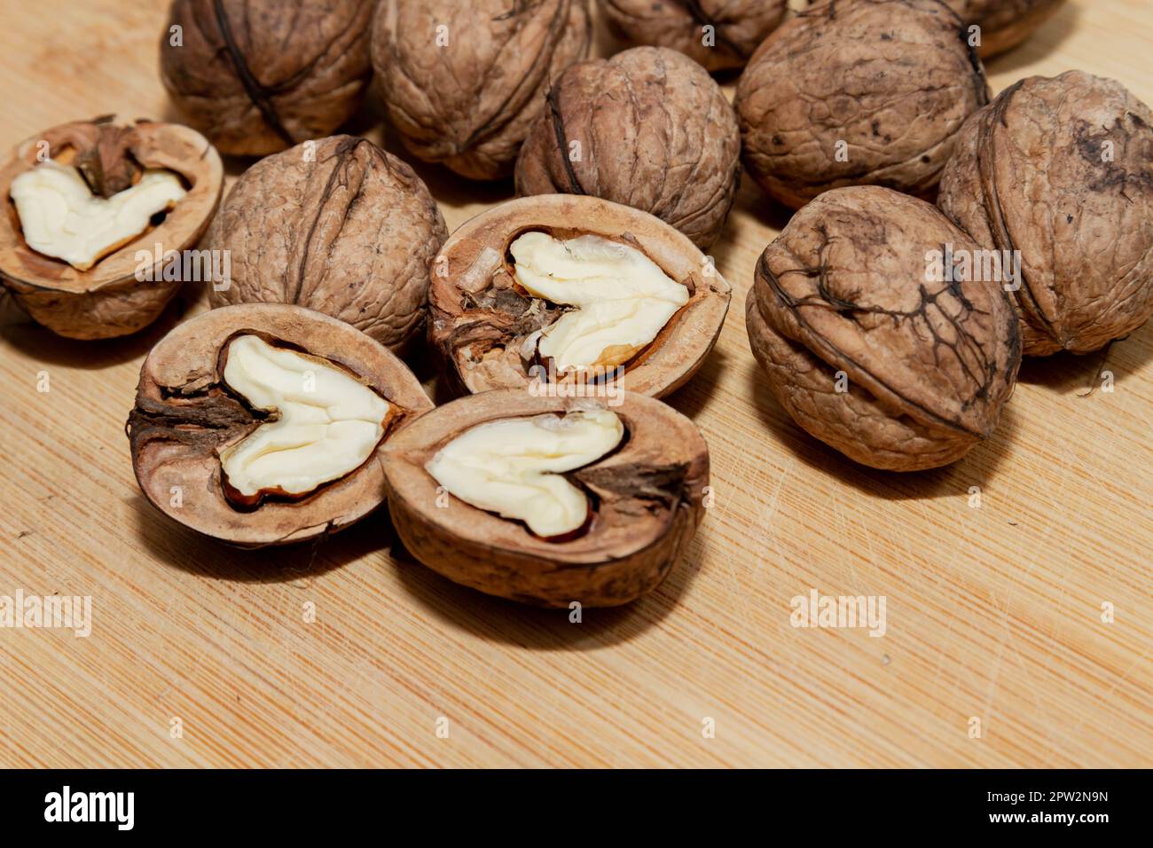 Walnut. Half walnut on natural background. Inshell nuts. Copyspace