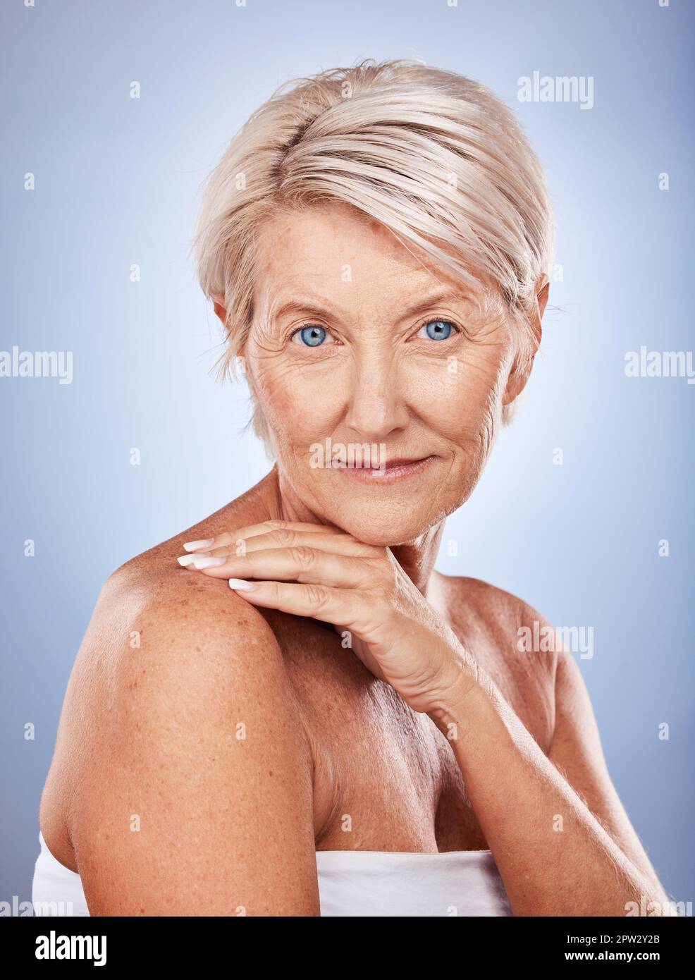 Face, portrait and skincare with a senior woman in studio on a gray background for wellness or natural care. Beauty, antiaging and luxury with a matur Stock Photo