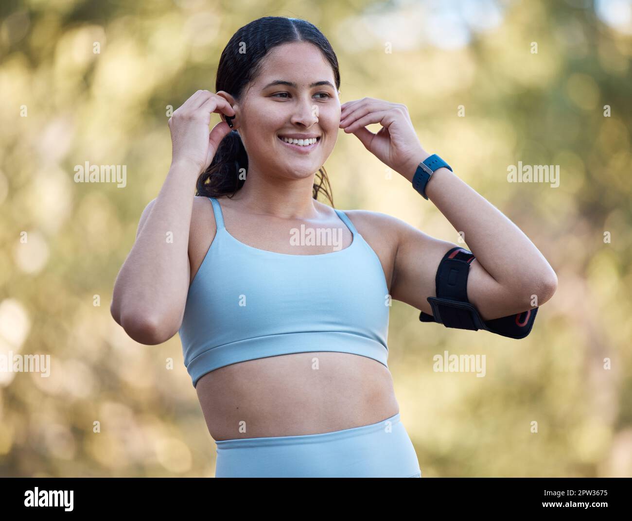 Woman, fitness and music with an athlete wearing earphones for