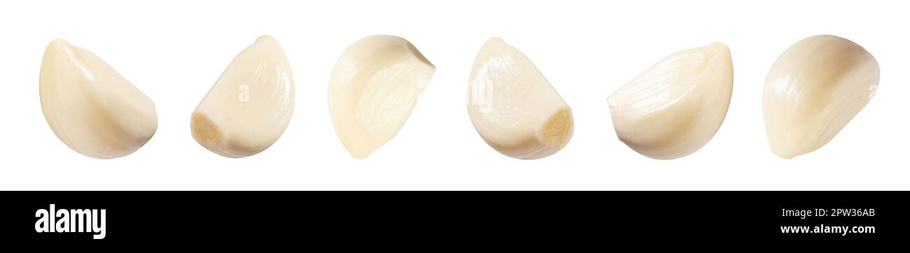 Falling peeled garlic cloves isolated on white background with clipping ...