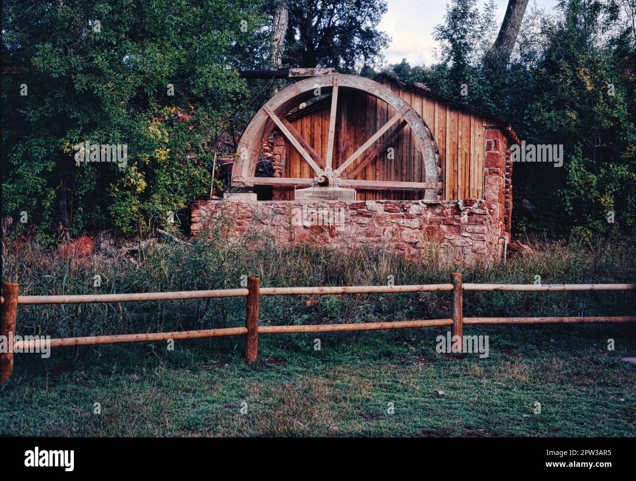 Old water powered grist mill restored and fenced Stock Photo Alamy