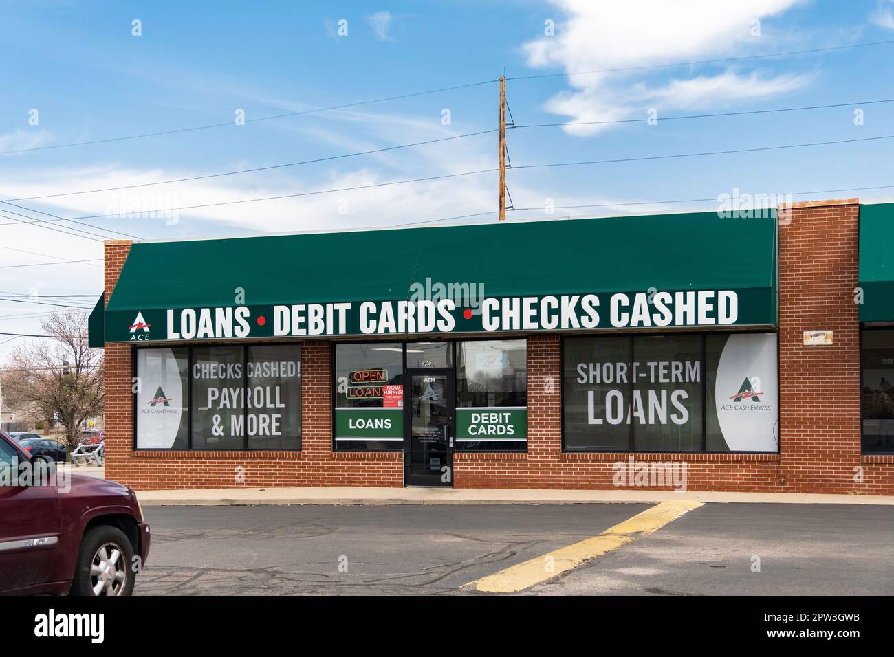 Storefront and entrance of a Loans, Debit Cards & Checks Cashed business, or fast cash, in Wichita, Kansas, USA. Stock Photo