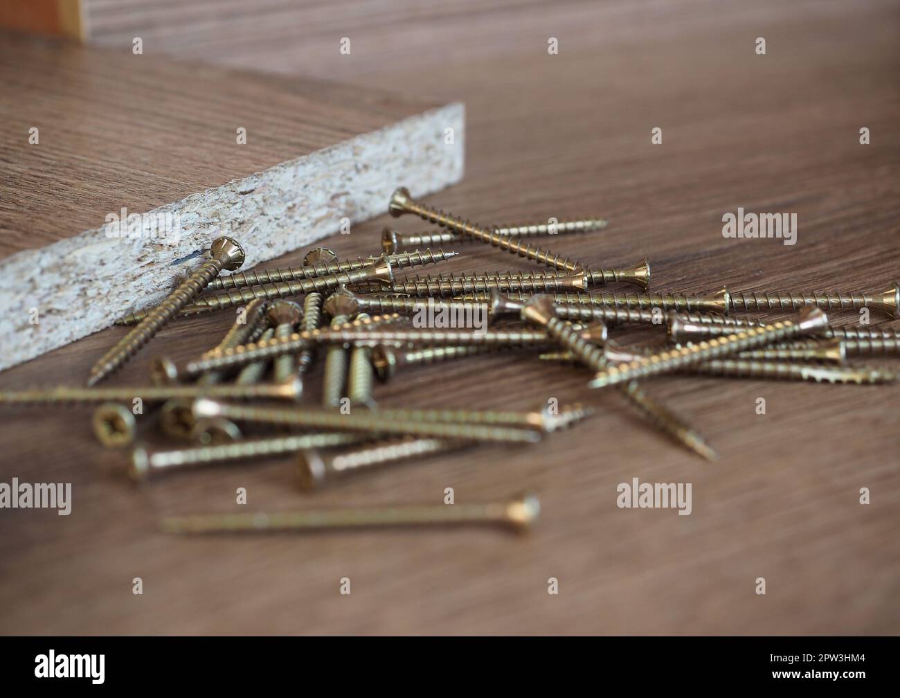 wood screws on melamine manufactured wood panel Stock Photo Alamy