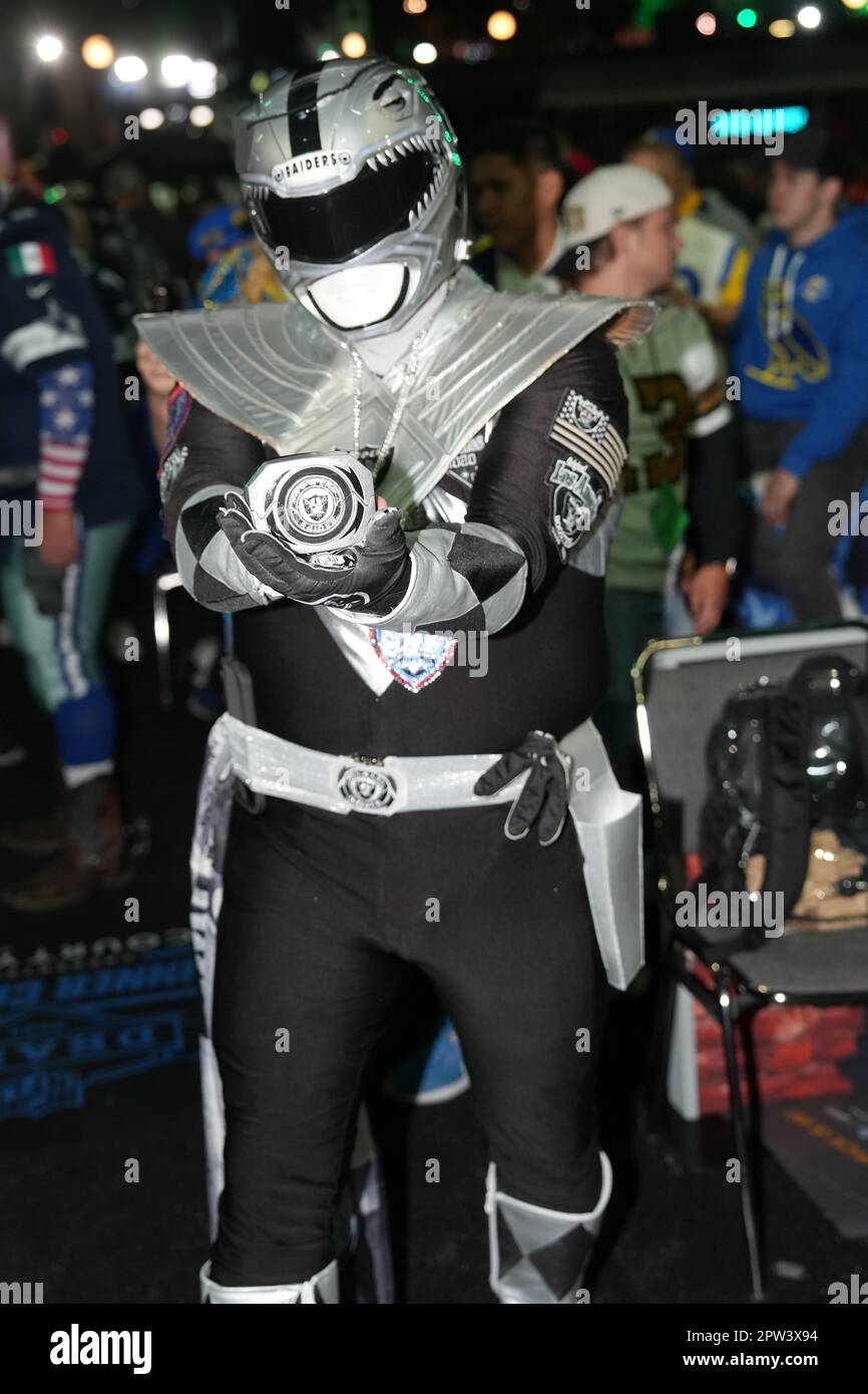Las Vegas Raiders fan dressed as a Power Ranger poses for a picture ...