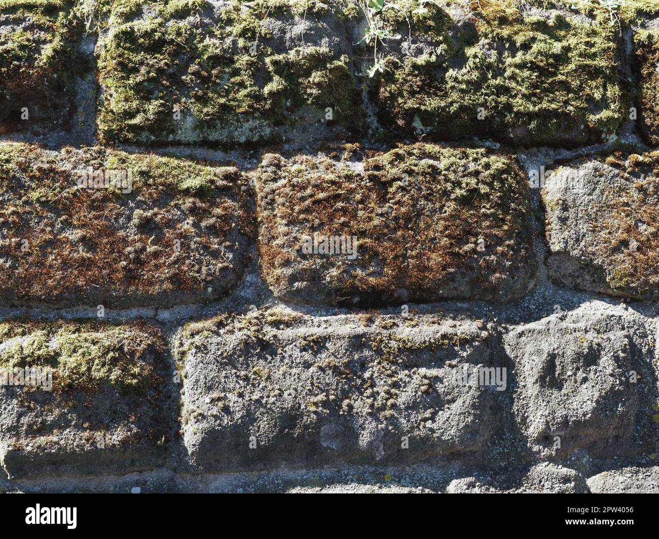 grey stone wall useful as a background Stock Photo - Alamy