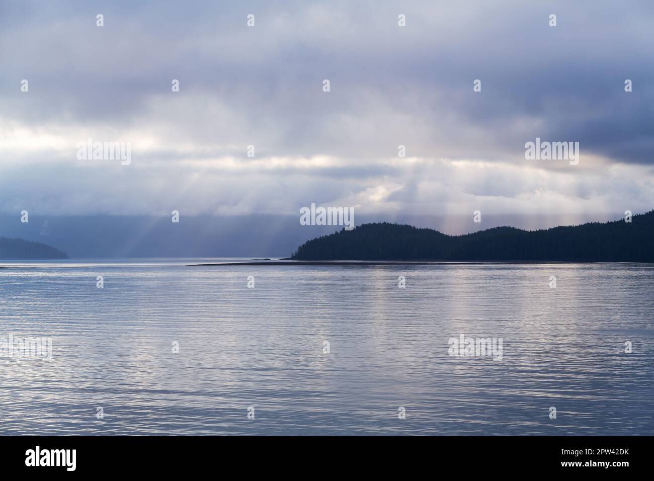 Sunbeam sunrise along islands of Inside Passage Cruise, British Columbia, Canada. Stock Photo