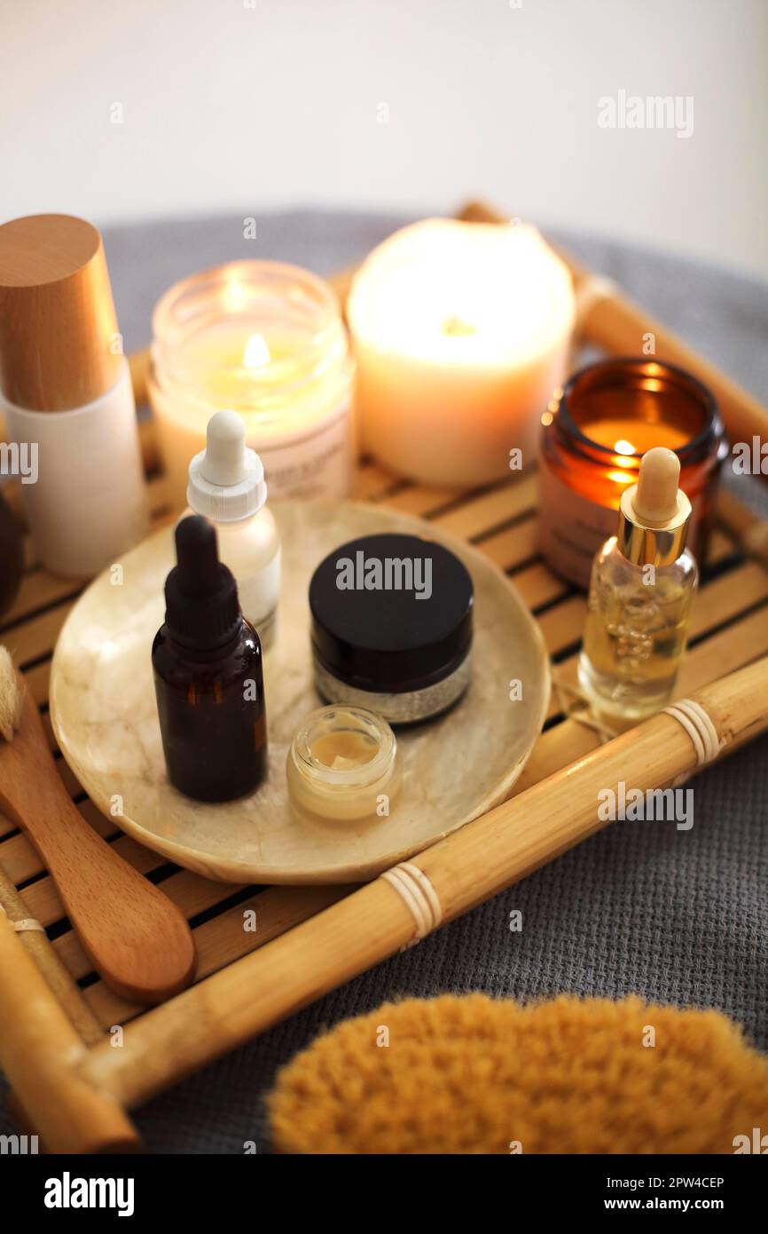 From above of aromatherapy candles and assorted skincare products