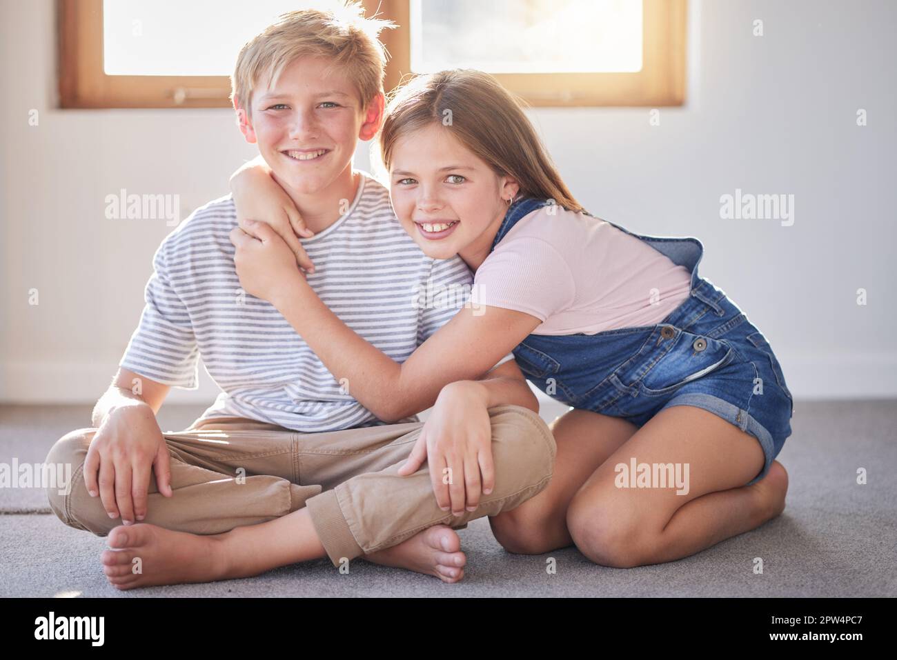 Home, kids portrait and hug of siblings or friends with youth fun and happiness together. Girl and child bonding, smiling and hugging with young frien Stock Photo
