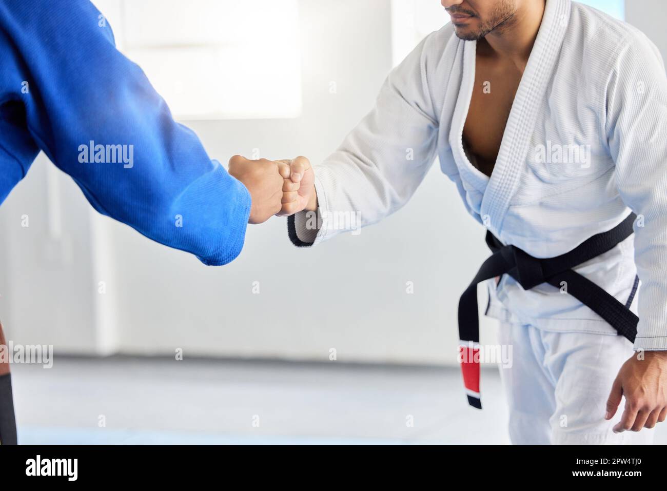 Karate, fighting tournament and men fist bump in martial arts competition for fighters with