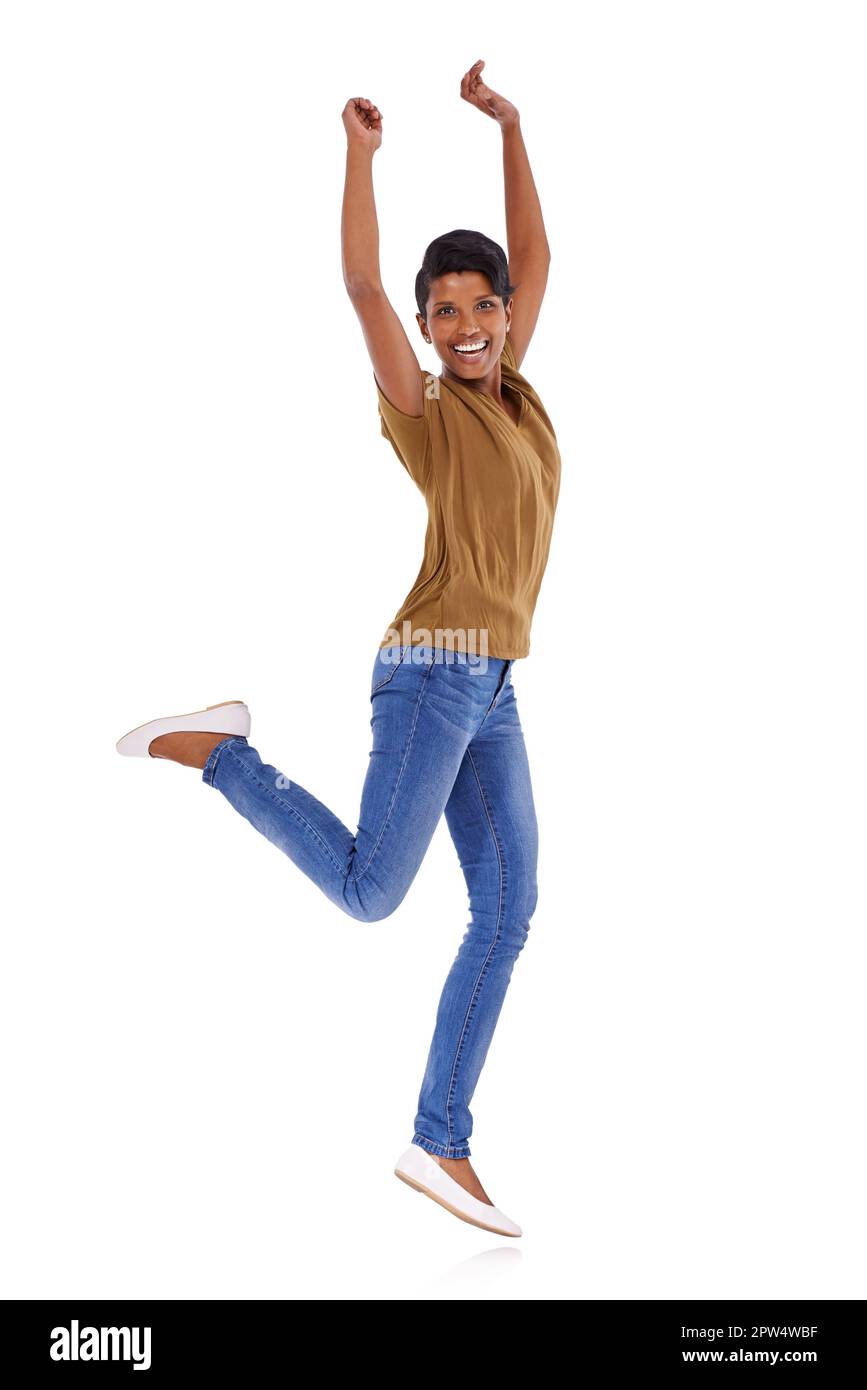Jump for joy. Studio portrait of an attractive young woman posing