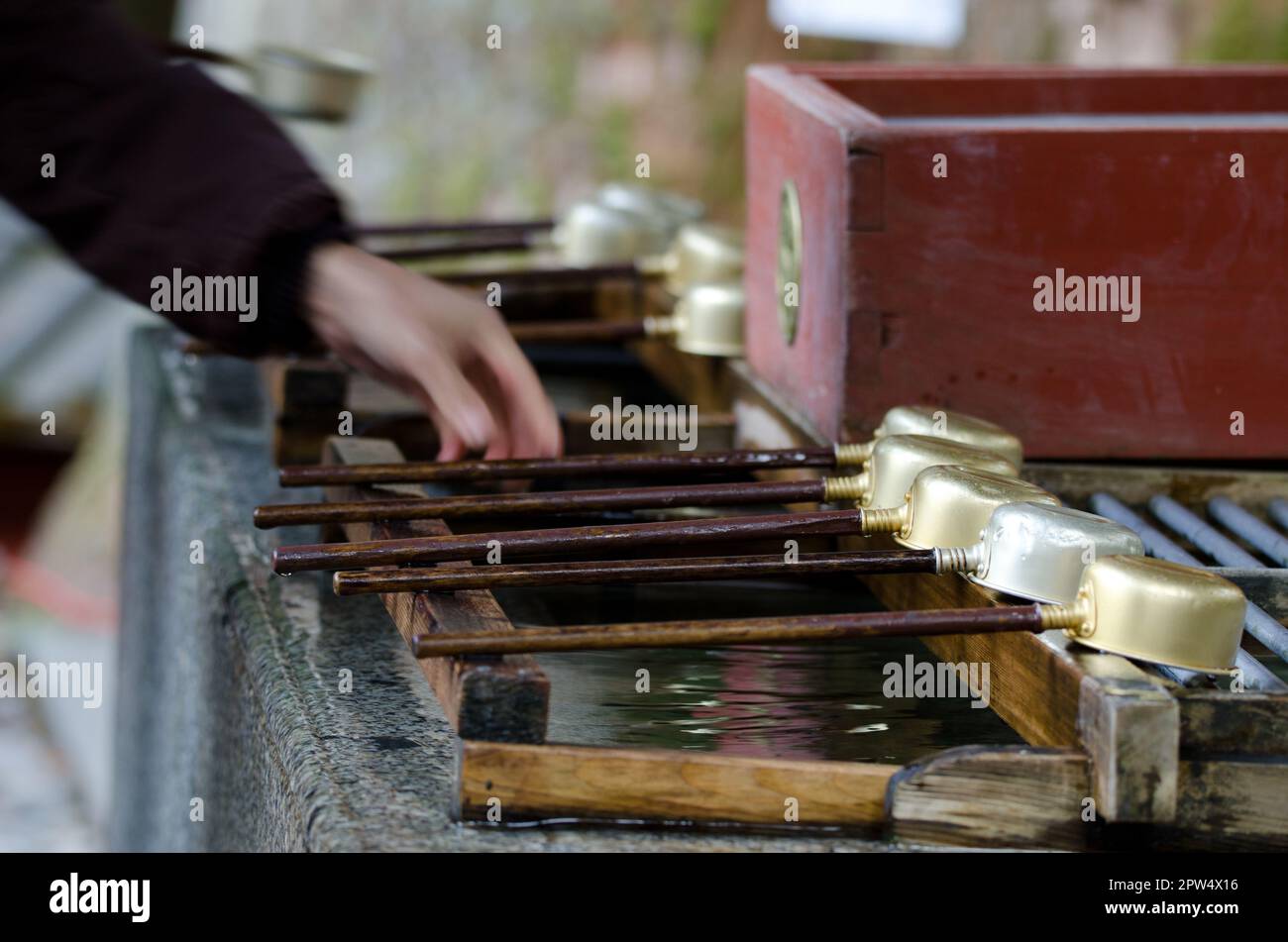 Dippers prepared for the ceremonial purification rite known as temizu ...