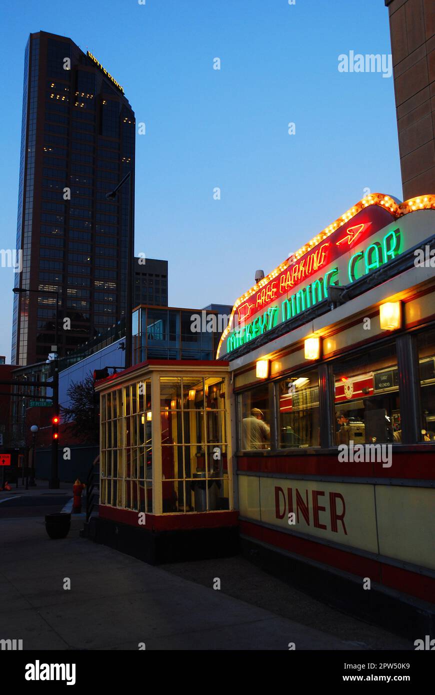 The Historic Mickeys Dining Car, a Jerry O'Mahony railroad car style Diner with a glowing neon light sign, sits in Downtown St Paul Minnesota Stock Photo