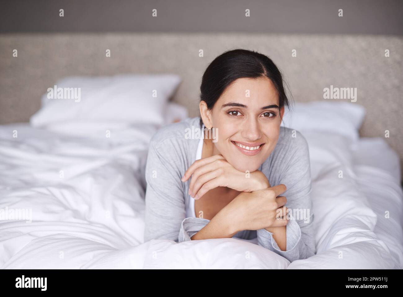 Treating herself to a relaxing day in bed. Portrait of an attractive