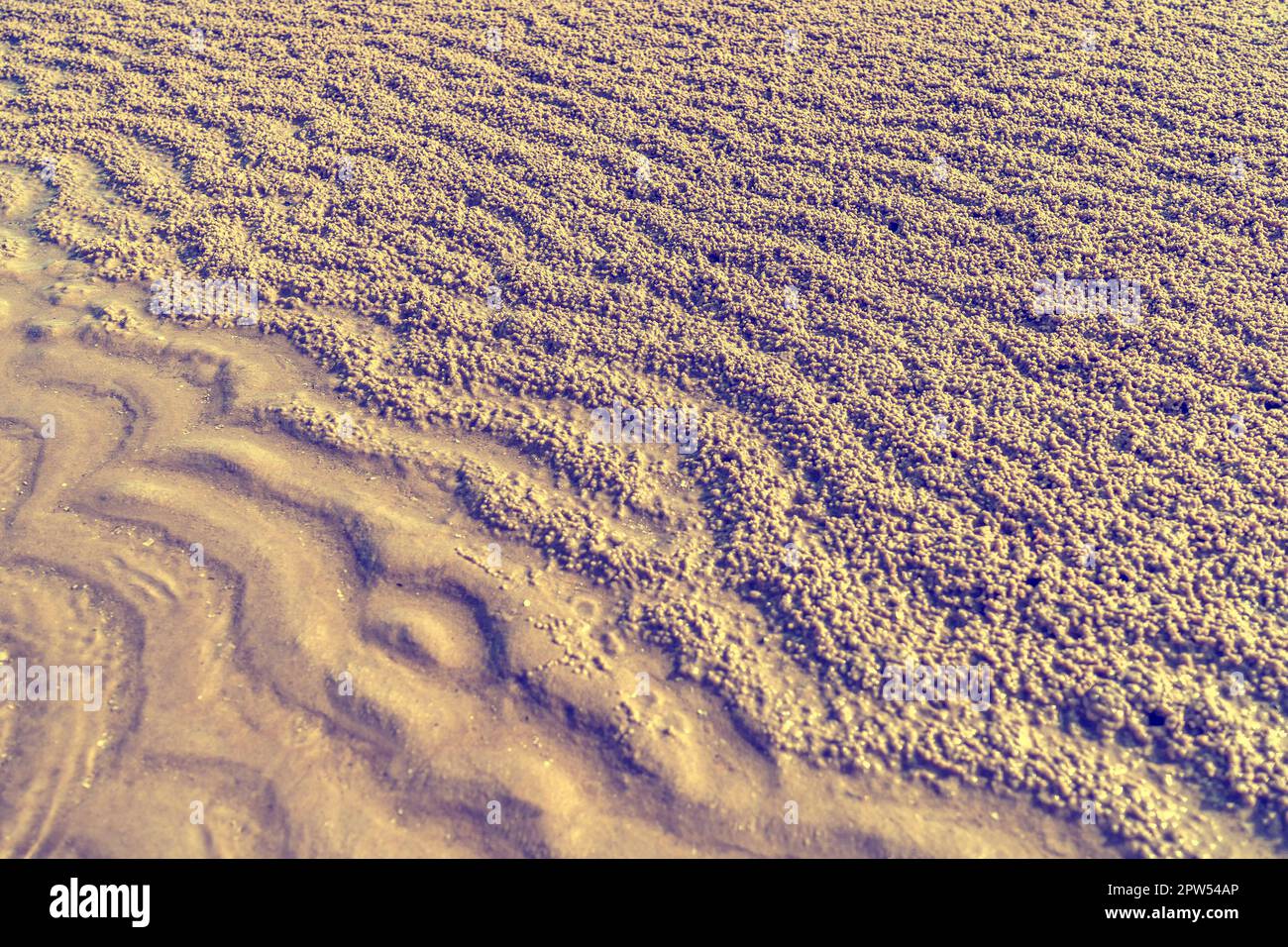 Waves on the sand and gravel nature texture Stock Photo - Alamy