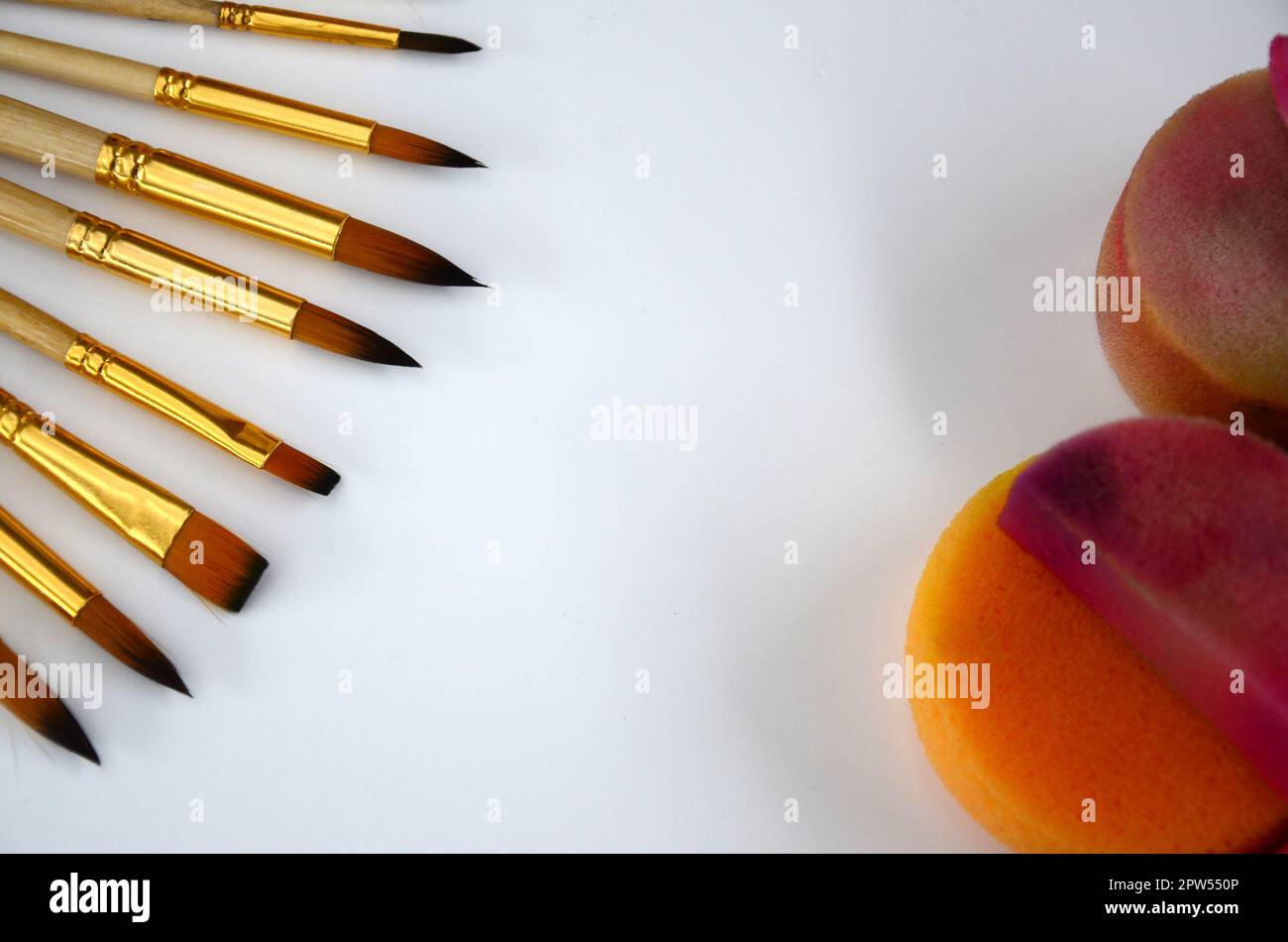 Color cosmetics, brushes and sponges for face painting on white