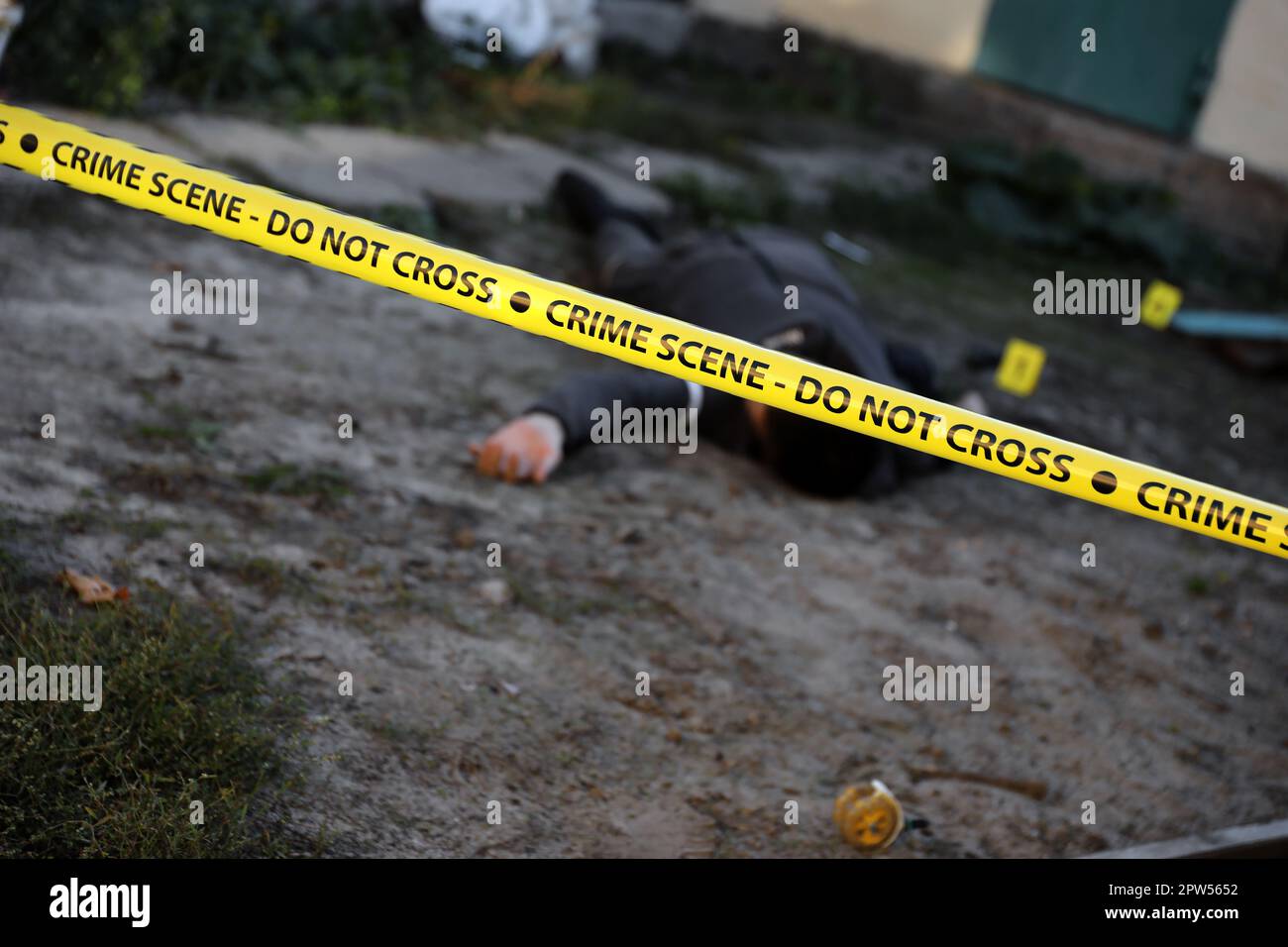 Victim of a violent crime in a backyard of residental house in evening