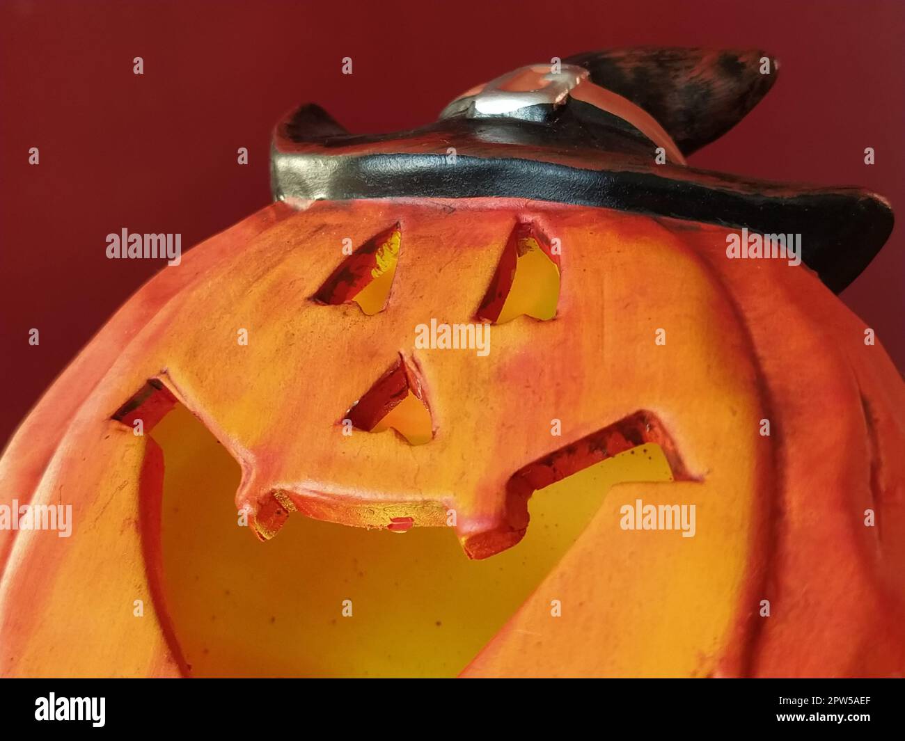 Bright orange Halloween pumpkin. Cut holes for mouth, nose and eyes