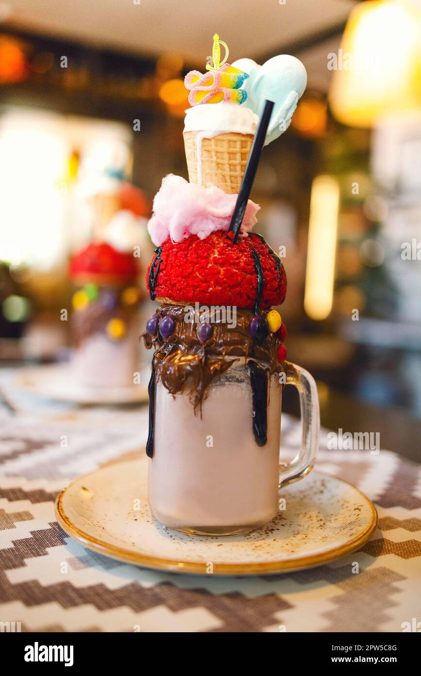 Chocolate milkshake with ice cream and whipped cream, marshmallows