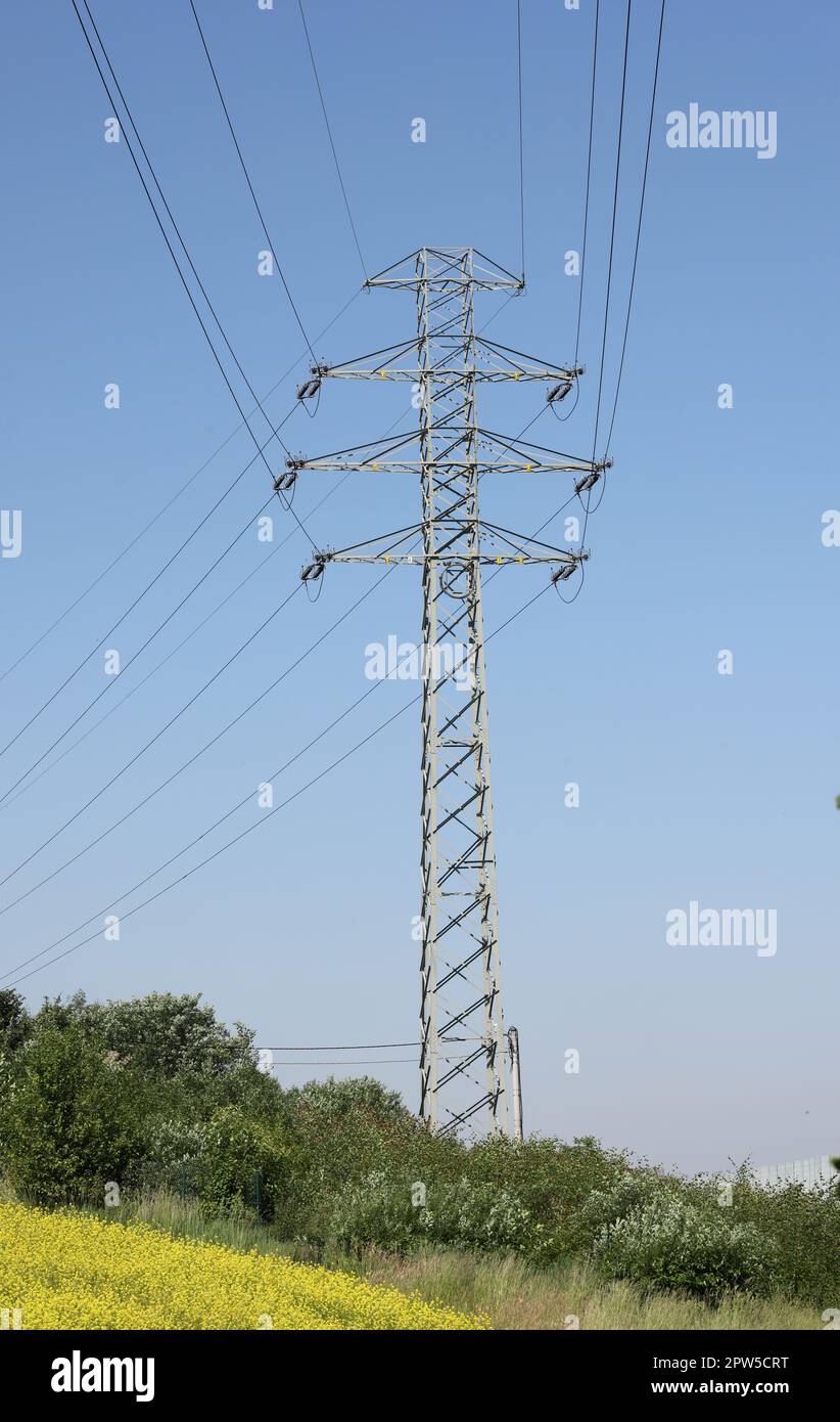 high voltage power pole and lines against the blue sky Stock Photo - Alamy